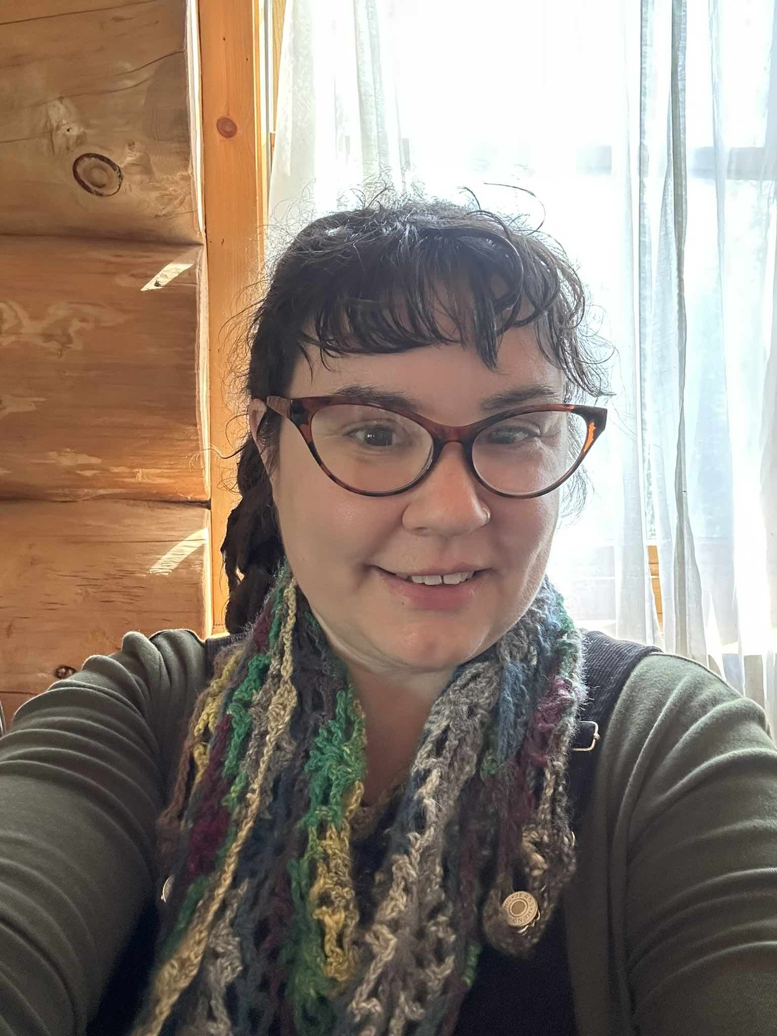 brown haired woman with glasses